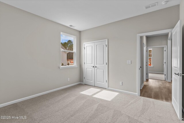 carpeted living room featuring lofted ceiling