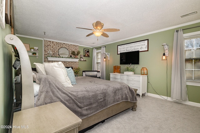 carpeted bedroom featuring a fireplace, a textured ceiling, ceiling fan, and crown molding