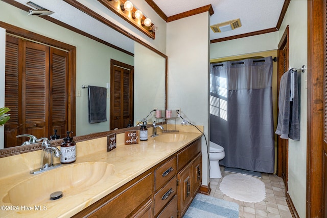 bathroom featuring vanity, tile patterned floors, toilet, ornamental molding, and a textured ceiling