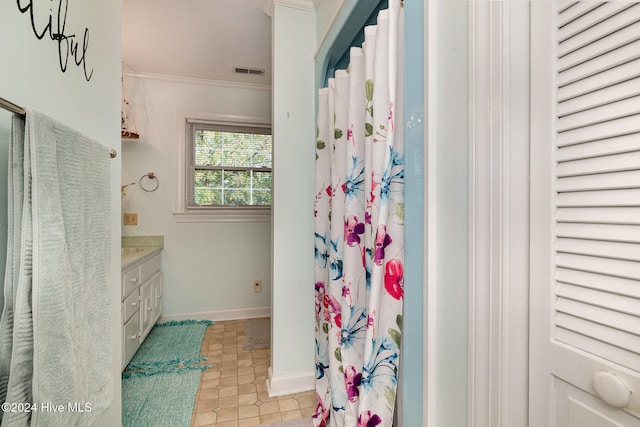 bathroom featuring vanity, curtained shower, and crown molding