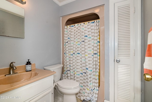 bathroom with a shower with curtain, vanity, toilet, and crown molding