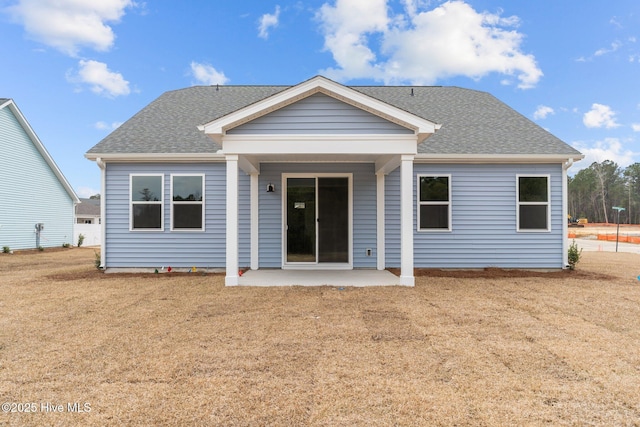 1957 Mansfield Ave SE, Bolivia, NC 28422 - rear view of house featuring a patio and a shingled roof