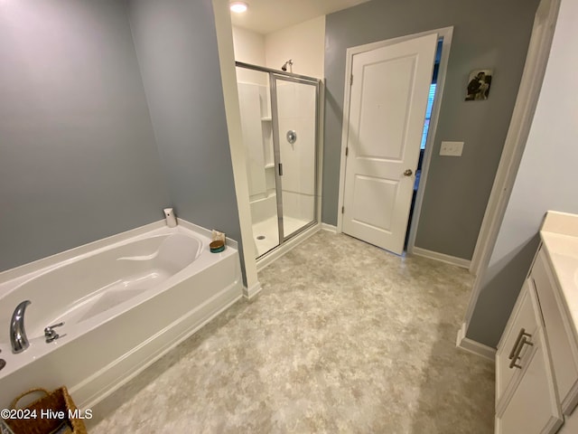 bathroom with separate shower and tub and vanity