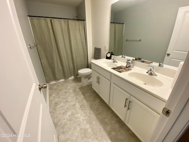 bathroom with vanity, toilet, curtained shower, and concrete floors