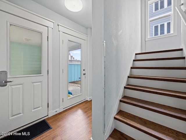 entryway with hardwood / wood-style floors