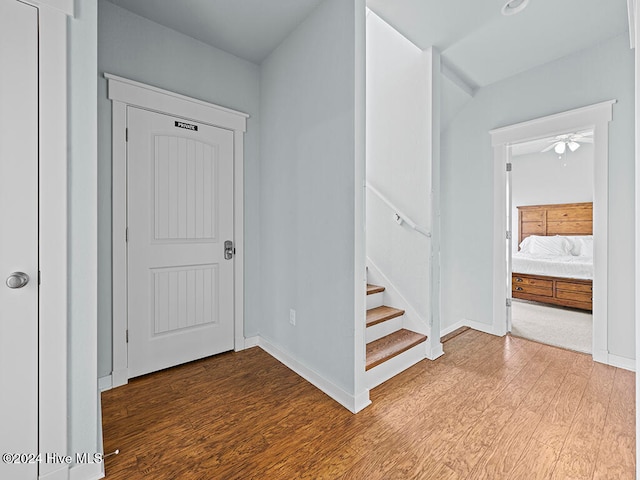 interior space featuring wood-type flooring and ceiling fan