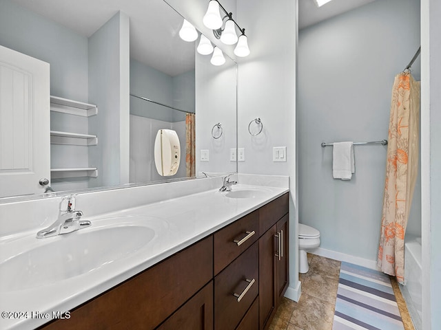 full bathroom with tile patterned floors, vanity, shower / tub combo, and toilet