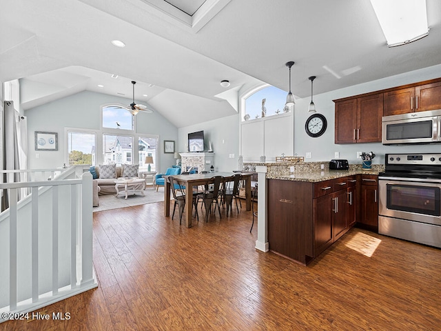 kitchen featuring plenty of natural light, ceiling fan, dark hardwood / wood-style floors, and appliances with stainless steel finishes