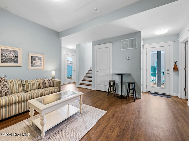 living room with dark hardwood / wood-style floors