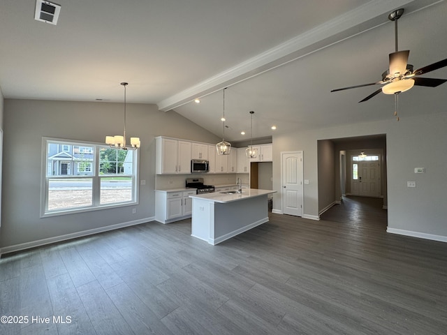 kitchen with a wealth of natural light, stainless steel appliances, baseboards, and a sink