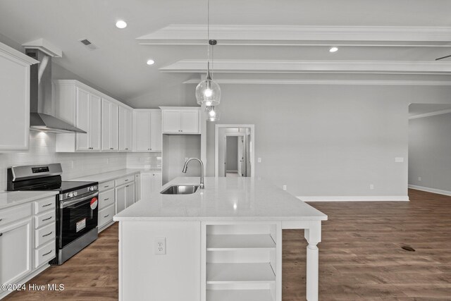 kitchen featuring wall chimney range hood, light stone counters, white cabinetry, and stainless steel range with electric stovetop