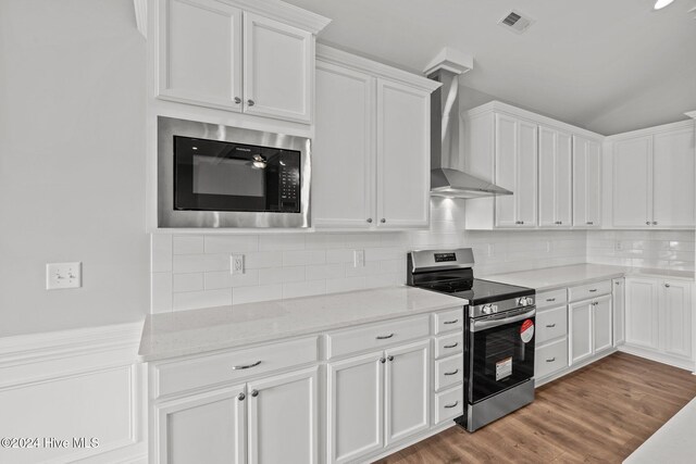 kitchen with decorative light fixtures, stainless steel dishwasher, sink, a premium fireplace, and an island with sink