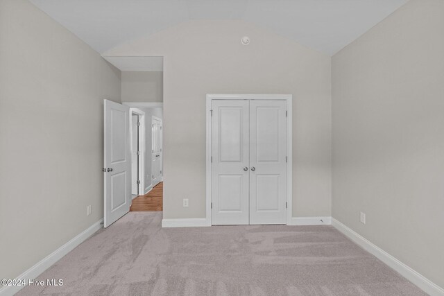 unfurnished living room featuring ceiling fan, crown molding, a fireplace, and wood-type flooring