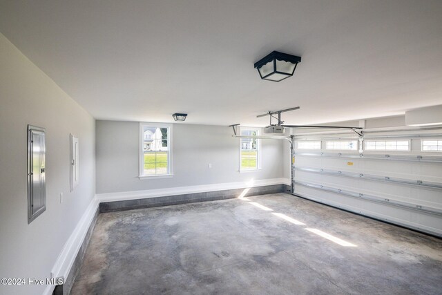 unfurnished bedroom featuring ceiling fan, light colored carpet, and a tray ceiling