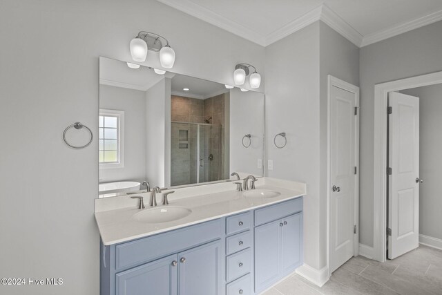 bathroom with sink, tile patterned flooring, crown molding, and shower with separate bathtub