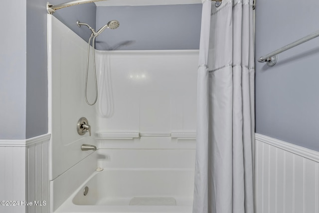 bathroom with shower / bath combination with curtain