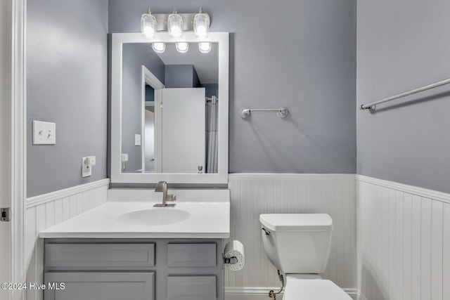 bathroom with vanity and toilet