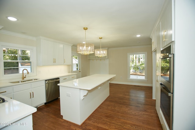 kitchen with stainless steel appliances, dark wood-type flooring, pendant lighting, a center island, and white cabinetry