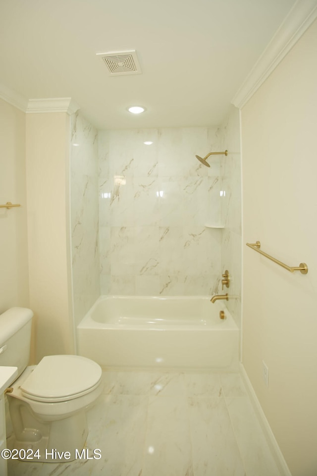 bathroom featuring crown molding, tiled shower / bath, and toilet