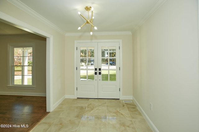 entryway with french doors, an inviting chandelier, wood-type flooring, and ornamental molding