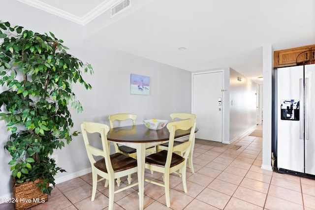 tiled dining area with ornamental molding