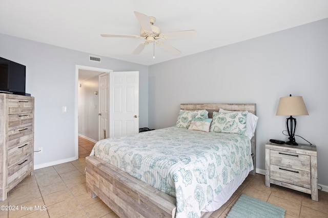 bedroom featuring ceiling fan and light tile patterned floors