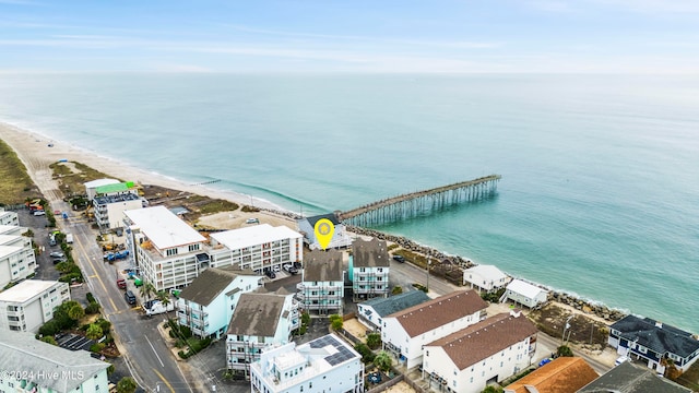 drone / aerial view with a water view and a view of the beach