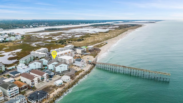 birds eye view of property featuring a view of the beach and a water view