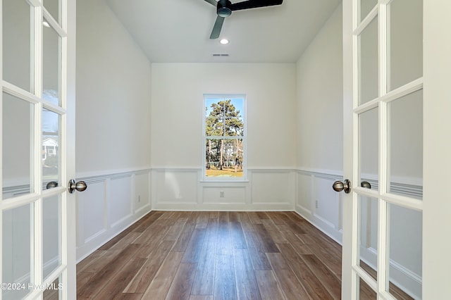 unfurnished room with ceiling fan, hardwood / wood-style floors, and french doors