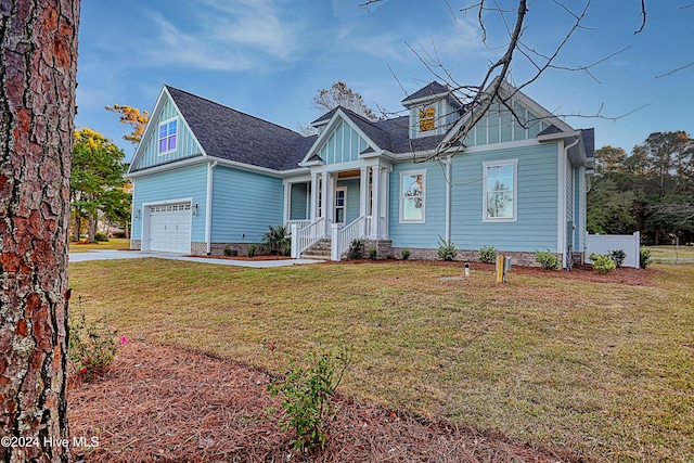 craftsman-style house with a front yard and a garage