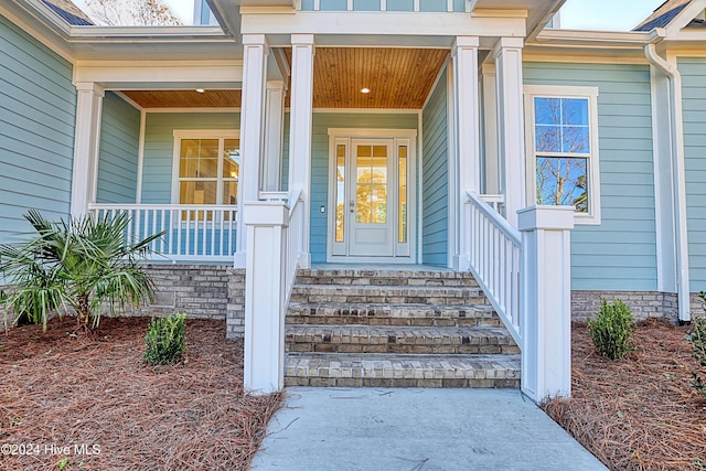 115 Genoes Point Rd SW, Supply, NC 28462 - view of exterior entry featuring a porch