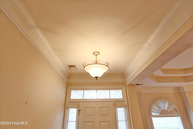 entrance foyer featuring crown molding