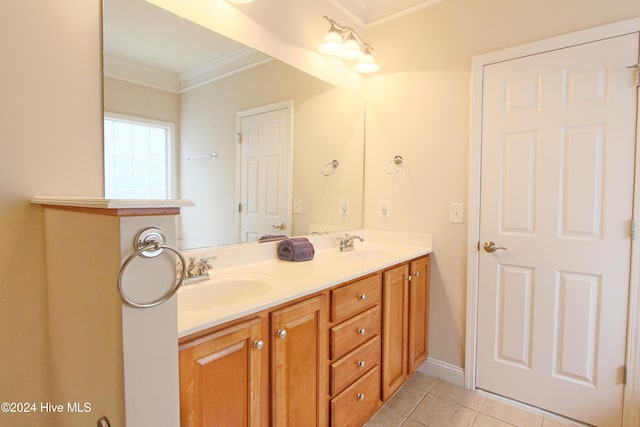 bathroom with tile patterned flooring, vanity, and crown molding