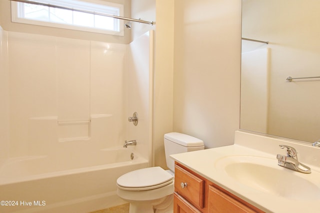 full bathroom featuring vanity, bathtub / shower combination, and toilet