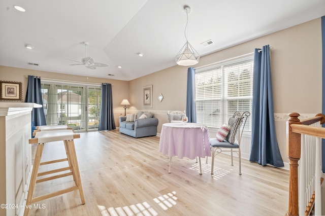 living room featuring ceiling fan and light hardwood / wood-style floors