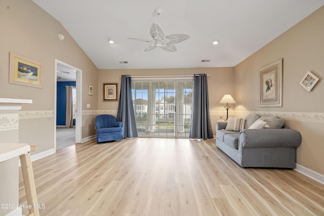 living area featuring light wood-type flooring, ceiling fan, and lofted ceiling