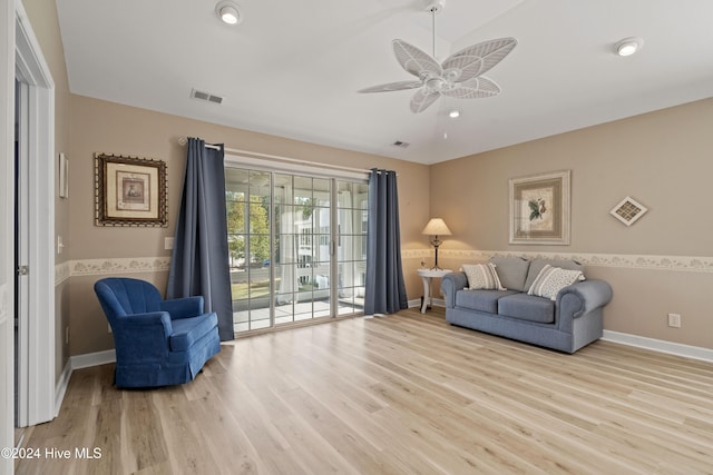 living area with ceiling fan and light wood-type flooring