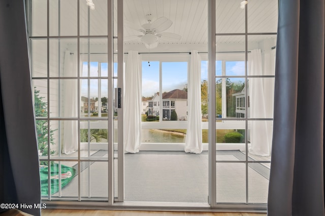 entryway featuring hardwood / wood-style flooring and ceiling fan