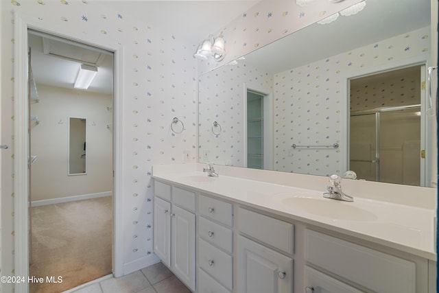 bathroom with vanity, tile patterned floors, and an enclosed shower