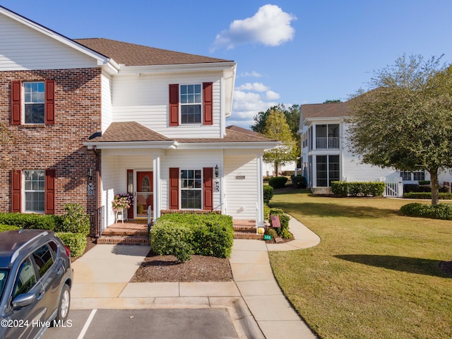 view of front of house with a front lawn