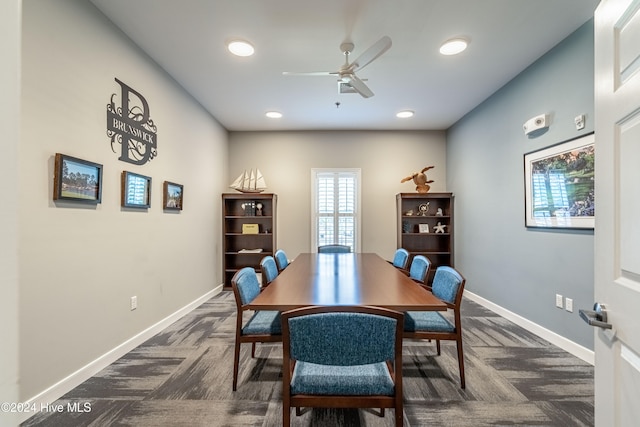 carpeted dining area featuring ceiling fan