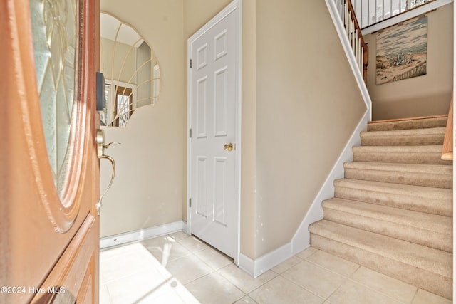 staircase featuring tile patterned floors