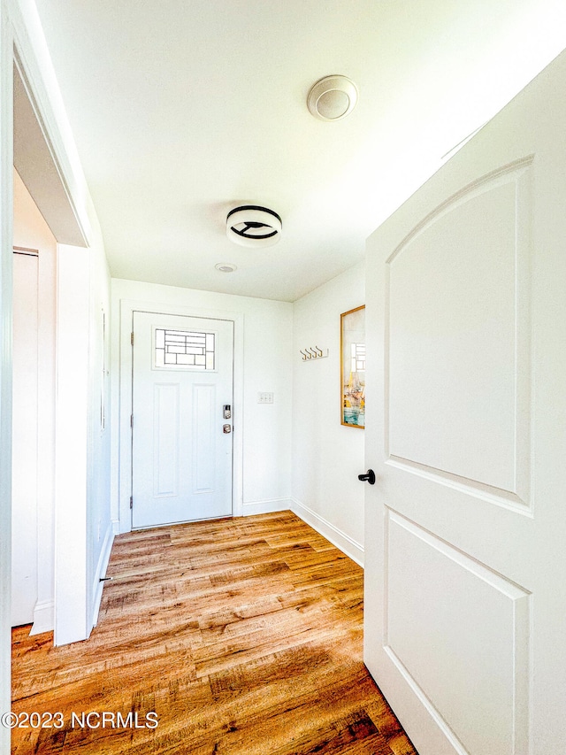 doorway with light hardwood / wood-style floors