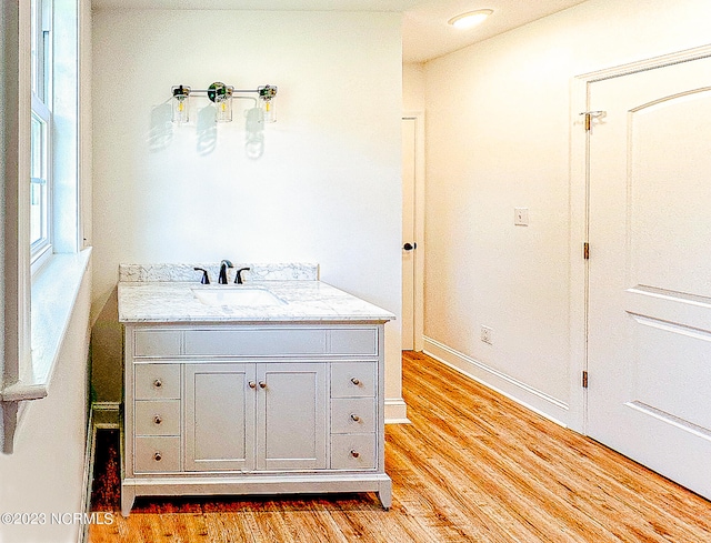 bathroom featuring vanity and hardwood / wood-style flooring