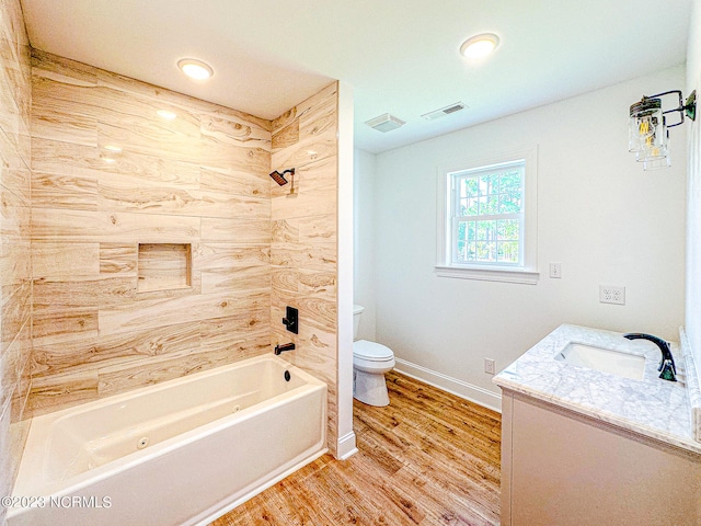 full bathroom with shower / bath combination, vanity, toilet, and wood-type flooring