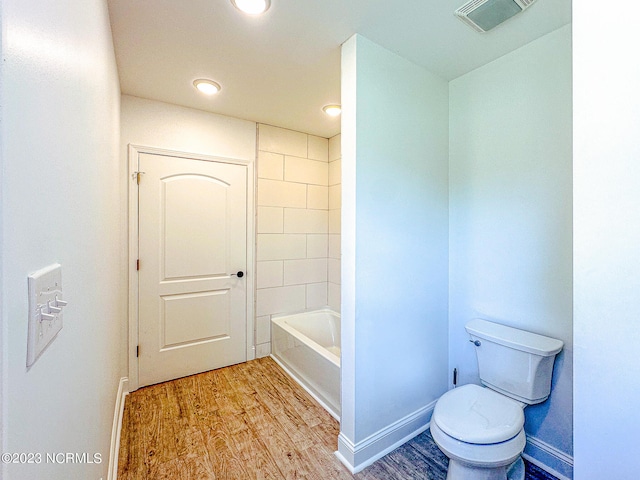 bathroom featuring toilet and hardwood / wood-style flooring