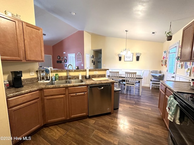 kitchen with dishwasher, sink, vaulted ceiling, dark hardwood / wood-style floors, and decorative light fixtures