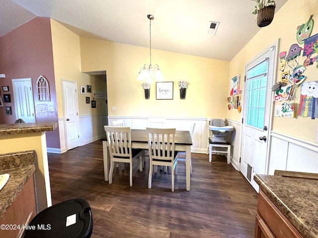 dining space featuring an inviting chandelier, dark hardwood / wood-style flooring, and vaulted ceiling