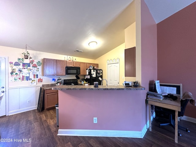 kitchen featuring sink, dark hardwood / wood-style flooring, kitchen peninsula, lofted ceiling, and black appliances