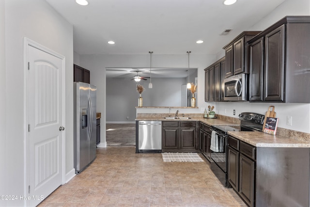 kitchen featuring ceiling fan, sink, stainless steel appliances, decorative light fixtures, and dark brown cabinets